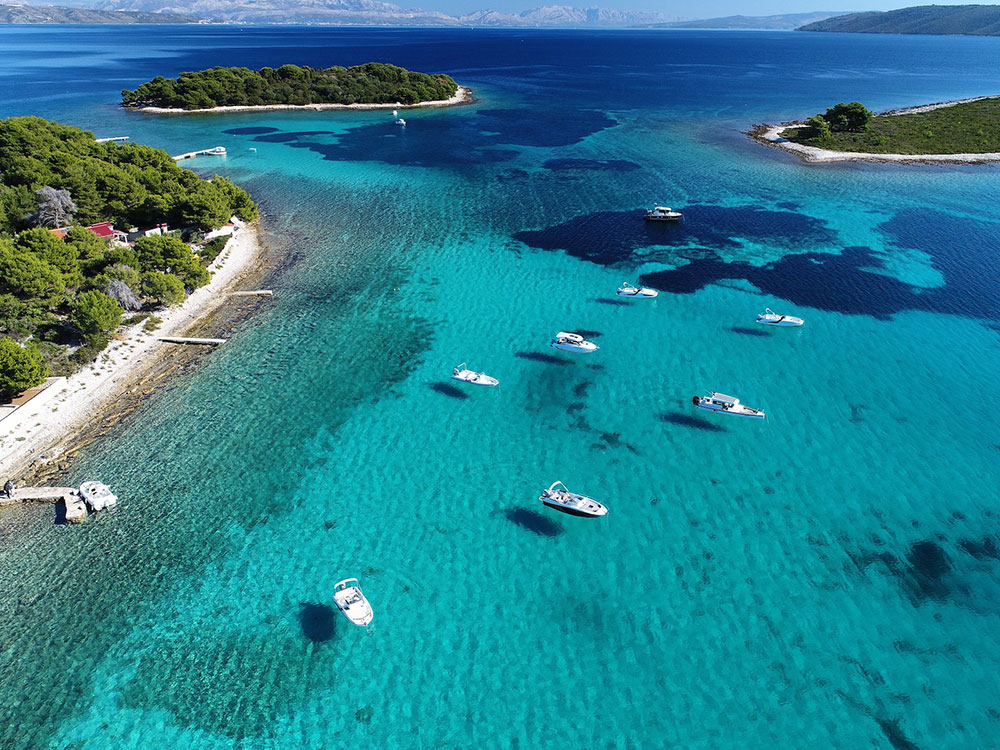 Blue Lagoon turquoise sea and speedboat